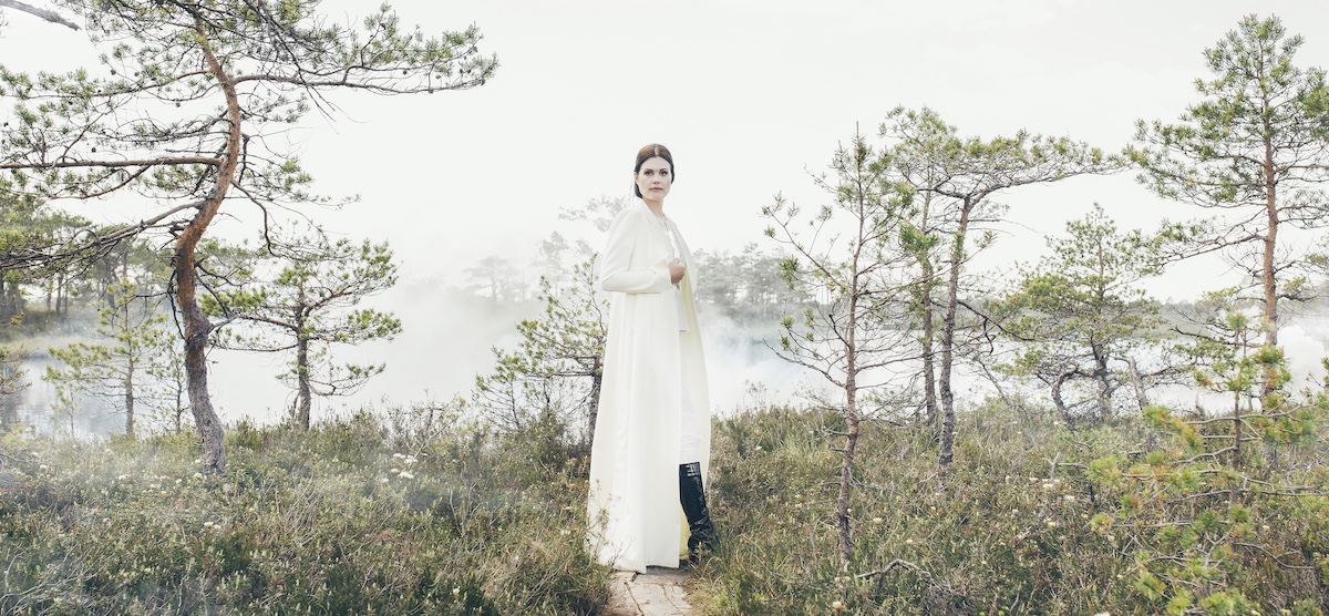 Dr. Helena Lass in front of a silent bog lake. Photo by Krõõt Tarkmeel.